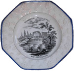 “Die Esplanade”, octagonal plate in black.